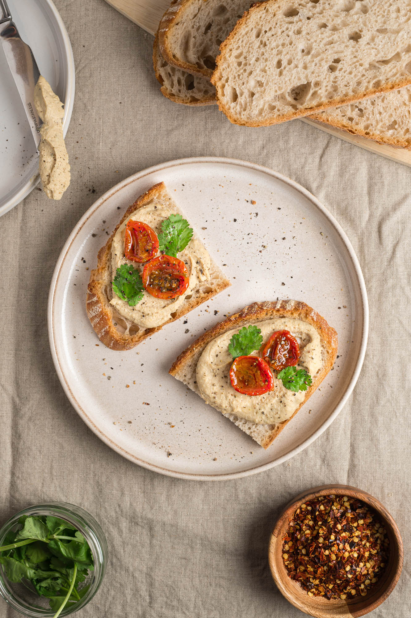 Hummus with datterini tomatoes on toast